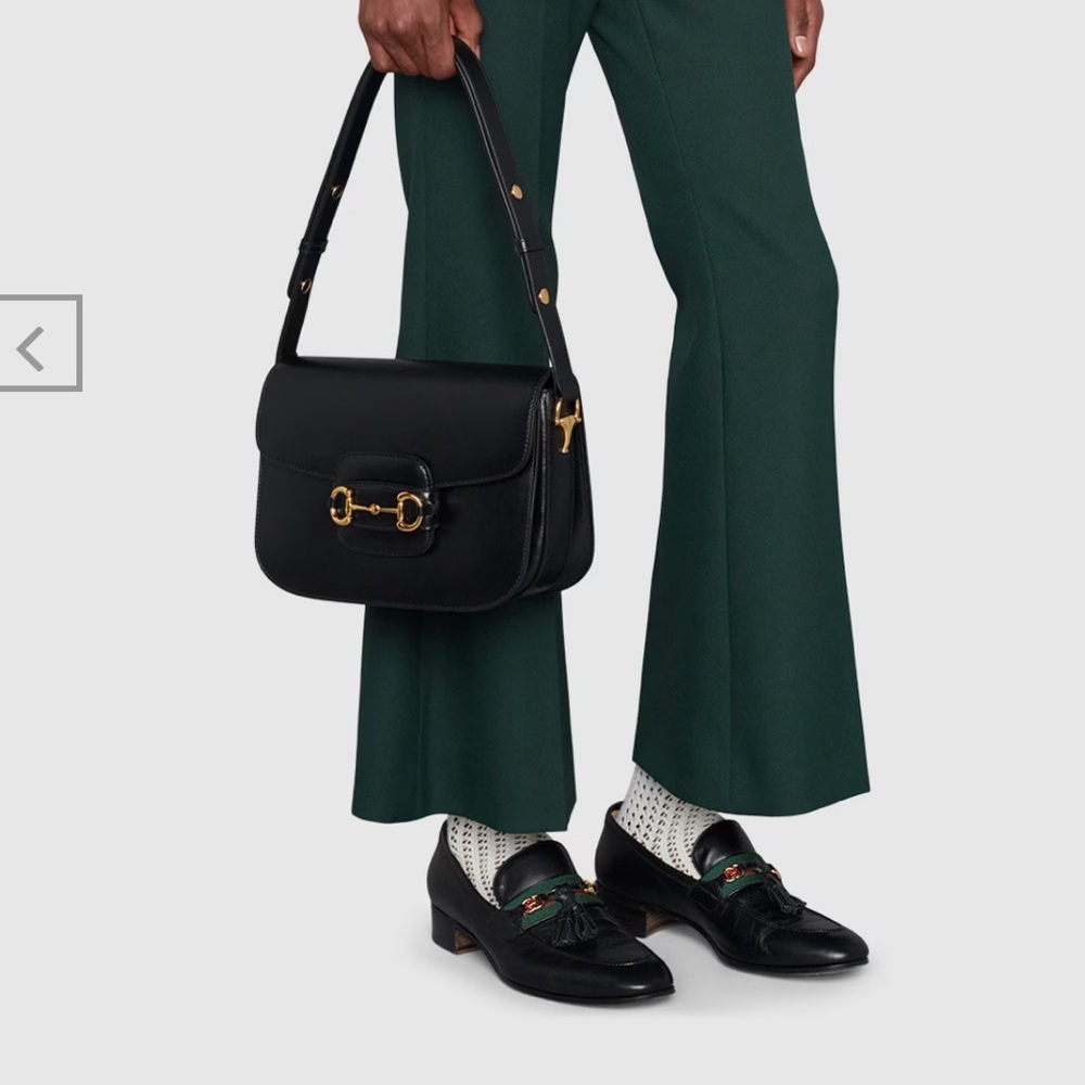 Practically new 1955 Gucci horsebit bag in black.